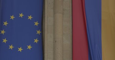 The EU and Armenian flags cover an old building undergoing renovation in central Gyumri. Armenia, Saturday, May 23, 2026. (AFP File Photo)