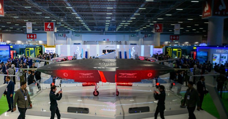 Visitors look at a Bayraktar Kızılelma unmanned fighter jet, developed by defense company Baykar, during the opening day of the SAHA 2026 defense fair, Istanbul, Türkiye, May 5, 2026. (AFP Photo)