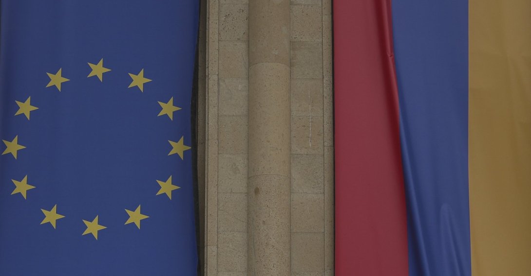The EU and Armenian flags cover an old building undergoing renovation in central Gyumri. Armenia, Saturday, May 23, 2026. (AFP File Photo)