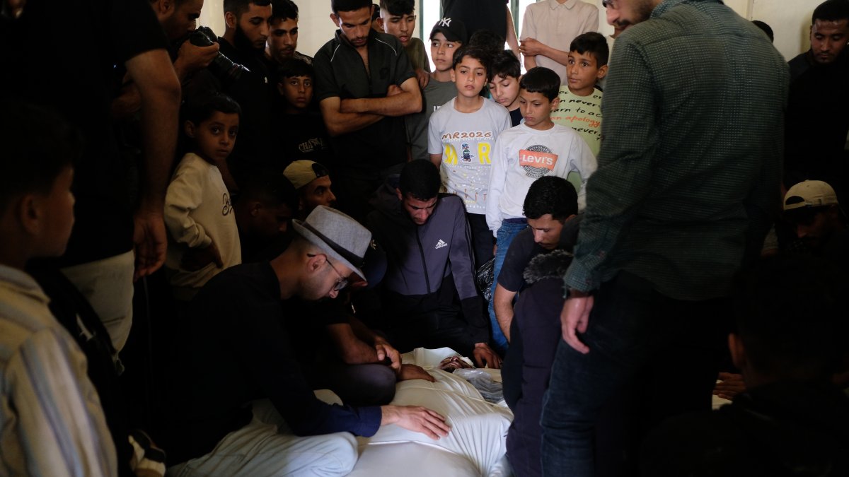 Palestinians mourn over the body of Mohammad Odeh, whom Israel says was a leader of Hamas Qassam Brigades, a day after he was killed in an Israeli airstrike, during his funeral, Gaza City, Palestine, May 27, 2026. (AP Photo)