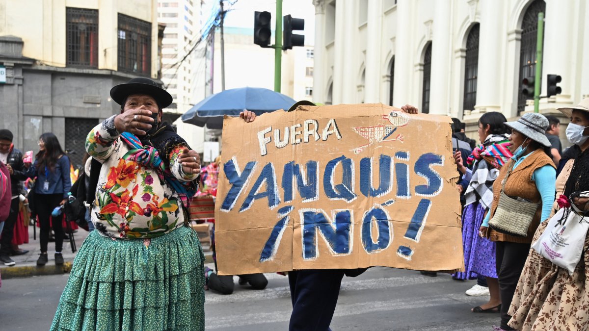An Aymara woman shouts next to a sign reading "Yankees Out! No!" during a protest led by women on Bolivia's Mother's Day, calling for the resignation of Bolivian President Rodrigo Paz, as the country's economic and fuel crisis worsens due to a shortage of U.S. dollars and declining domestic energy production, in La Paz, Bolivia, May 27, 2026. (Reuters Photo)