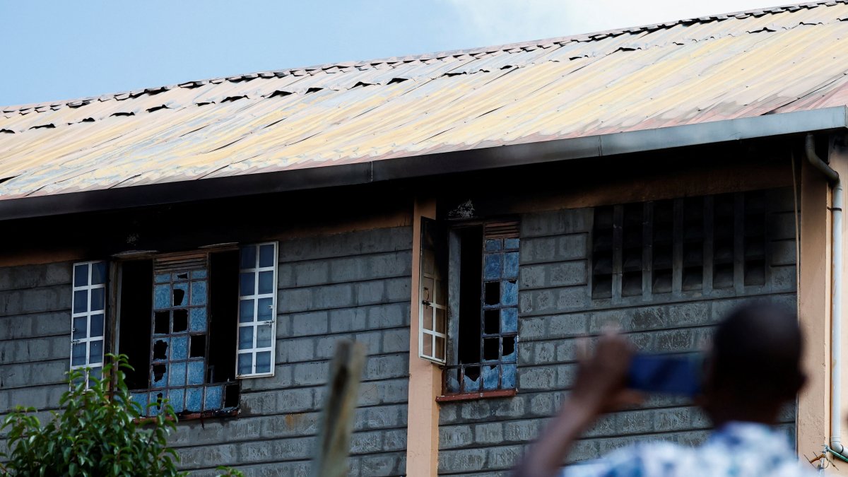 Parents take photographs of the ruins of the dormitory following an overnight fire at the Utumishi Girls' Academy Senior School in Gilgil, Nakuru county, Kenya, May 28, 2026. (Reuters Photo)