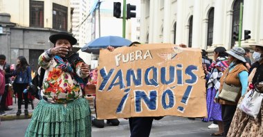 An Aymara woman shouts next to a sign reading "Yankees Out! No!" during a protest led by women on Bolivia's Mother's Day, calling for the resignation of Bolivian President Rodrigo Paz, as the country's economic and fuel crisis worsens due to a shortage of U.S. dollars and declining domestic energy production, in La Paz, Bolivia, May 27, 2026. (Reuters Photo)