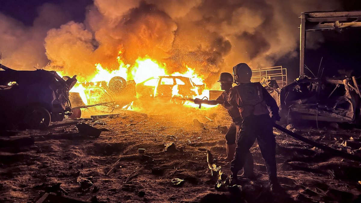 Civil defense workers attempt to extinguish a fire following an Israeli strike on a warehouse in Khan Younis, southern Gaza, Palestine, May 28, 2026. (Reuters Photo)