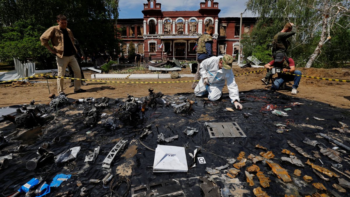 An investigator works in front of the building of the college destroyed by a Ukrainian drone attack, Starobelsk, Luhansk region, Ukraine, May 24, 2026. (Reuters Photo)