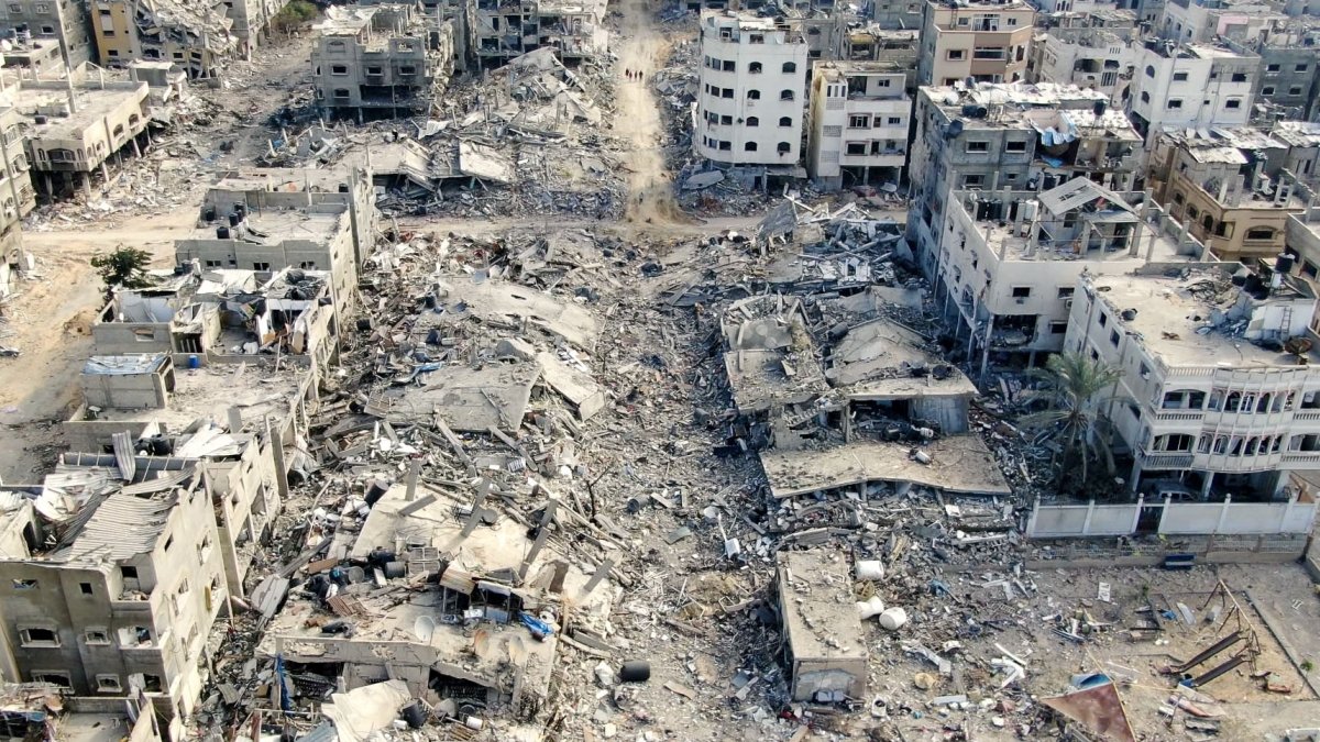 An aerial view shows destroyed buildings in Beit Lahia following Israeli bombardments in the northern Gaza Strip, Dec. 26, 2023. (AFP File Photo)