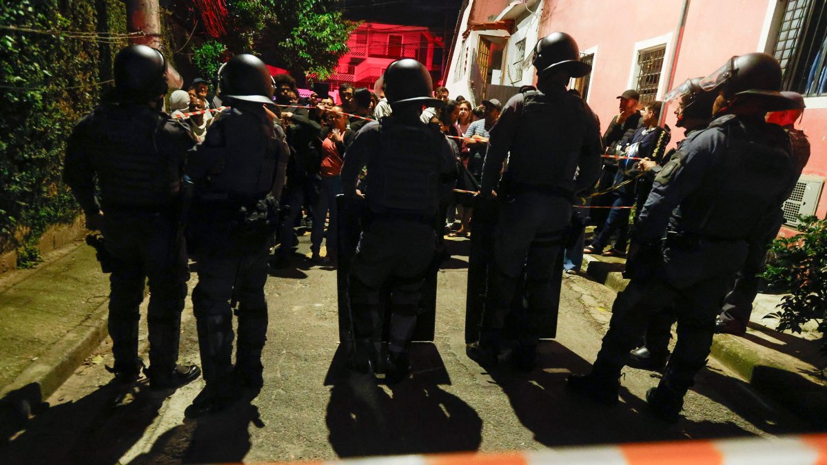 Riot police secure the area as residents look on in the Jaguare neighborhood of Sao Paulo, Brazil, May 11, 2026. (AFP File Photo)