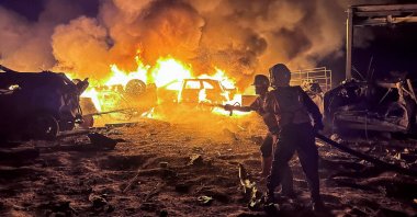 Civil defense workers attempt to extinguish a fire following an Israeli strike on a warehouse in Khan Younis, southern Gaza, Palestine, May 28, 2026. (Reuters Photo)