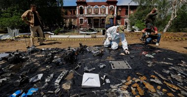 An investigator works in front of the building of the college destroyed by a Ukrainian drone attack, Starobelsk, Luhansk region, Ukraine, May 24, 2026. (Reuters Photo)