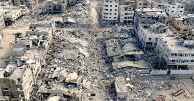 An aerial view shows destroyed buildings in Beit Lahia following Israeli bombardments in the northern Gaza Strip, Dec. 26, 2023. (AFP File Photo)