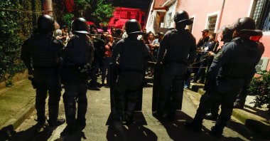 Riot police secure the area as residents look on in the Jaguare neighborhood of Sao Paulo, Brazil, May 11, 2026. (AFP File Photo)