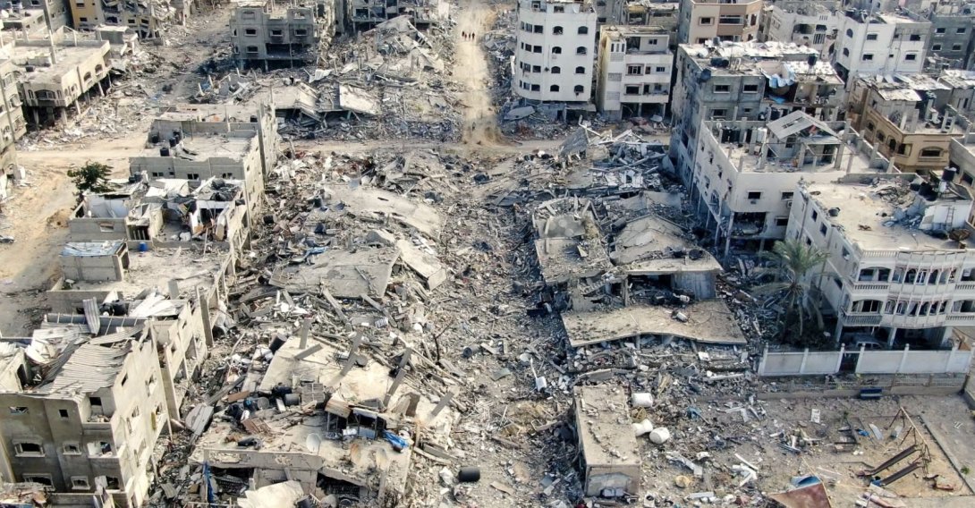 An aerial view shows destroyed buildings in Beit Lahia following Israeli bombardments in the northern Gaza Strip, Dec. 26, 2023. (AFP File Photo)