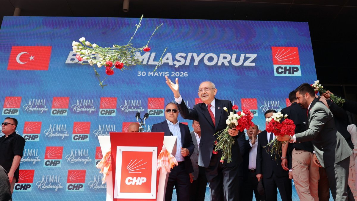 CHP Chair Kemal Kılıçdaroğlu throws flowers toward supporters outside the party's headquarters, Ankara, Türkiye, May 30, 2026. (EPA Photo)