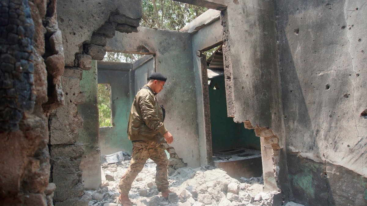 Saw Win Myint, a commander of a military unit under the Karen National Union, the leading political body for the Karen ethnic minority that is part of the resistance against military rule in Myanmar, inspects the damaged armory in the captured army base of Infantry Battalion 275 in Myawaddy township in Kayin state, Myanmar, April 12, 2024. (AP Photo)