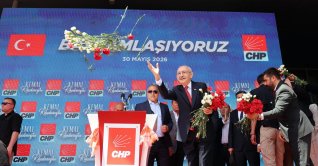 CHP Chair Kemal Kılıçdaroğlu throws flowers toward supporters outside the party's headquarters, Ankara, Türkiye, May 30, 2026. (EPA Photo)