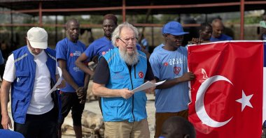 Mehmet Şahin, the Türkiye Diyanet Foundation's oldest volunteer, delivers a speech during a humanitarian aid mission, Abuja, Nigeria, May 27, 2025. (AA Photo)