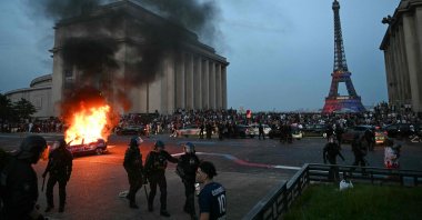 A car is set ablaze as PSG supporters celebrate their team's win against Arsenal FC in the UEFA Champions League final, Paris, France, May 30, 2026. (AFP Photo)