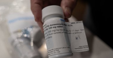 Menta "Steve" Wallace shows a bottle of daraxonrasib, Revolution Medicine's pancreatic cancer drug, at his home in The Woodlands, Texas, U.S., May 29, 2026. (Reuters Photo)
