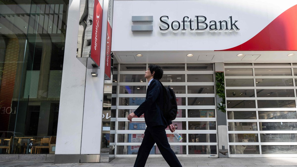 A man walks past a Softbank store in Tokyo, Japan, May 13, 2026. (AFP Photo)