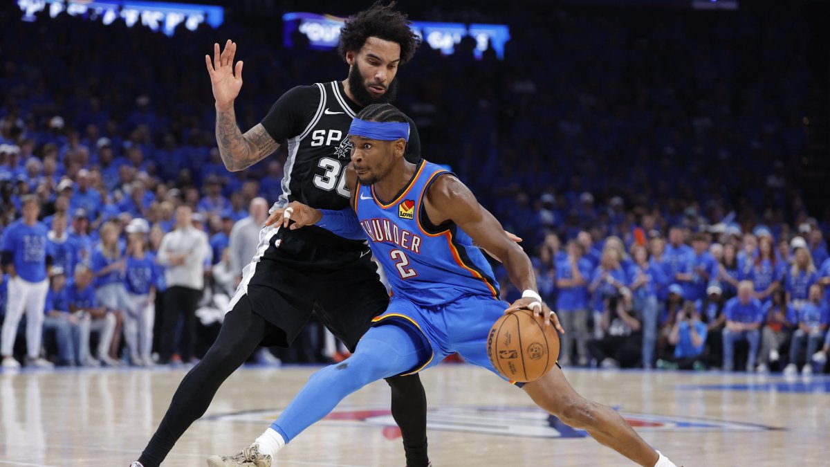 Oklahoma City Thunder's Shai Gilgeous-Alexander (R) controls the ball against San Antonio Spurs forward Julian Champagnie in the fourth quarter during game seven of the Western Conference Finals for the 2026 NBA playoffs at Paycom Center, Oklahoma, U.S., May 30, 2026. (Reuters Photo)