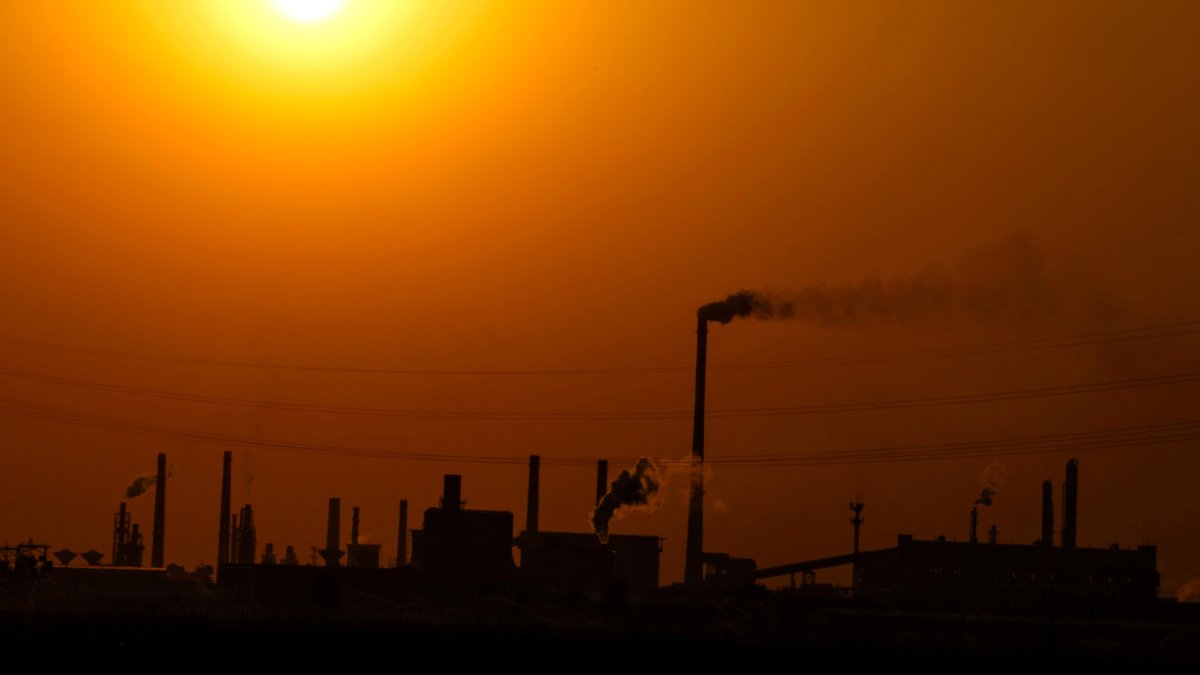 Factories are silhouetted during sunset, Handan, Hebei province, China, April 7, 2026. (Reuters Photo)