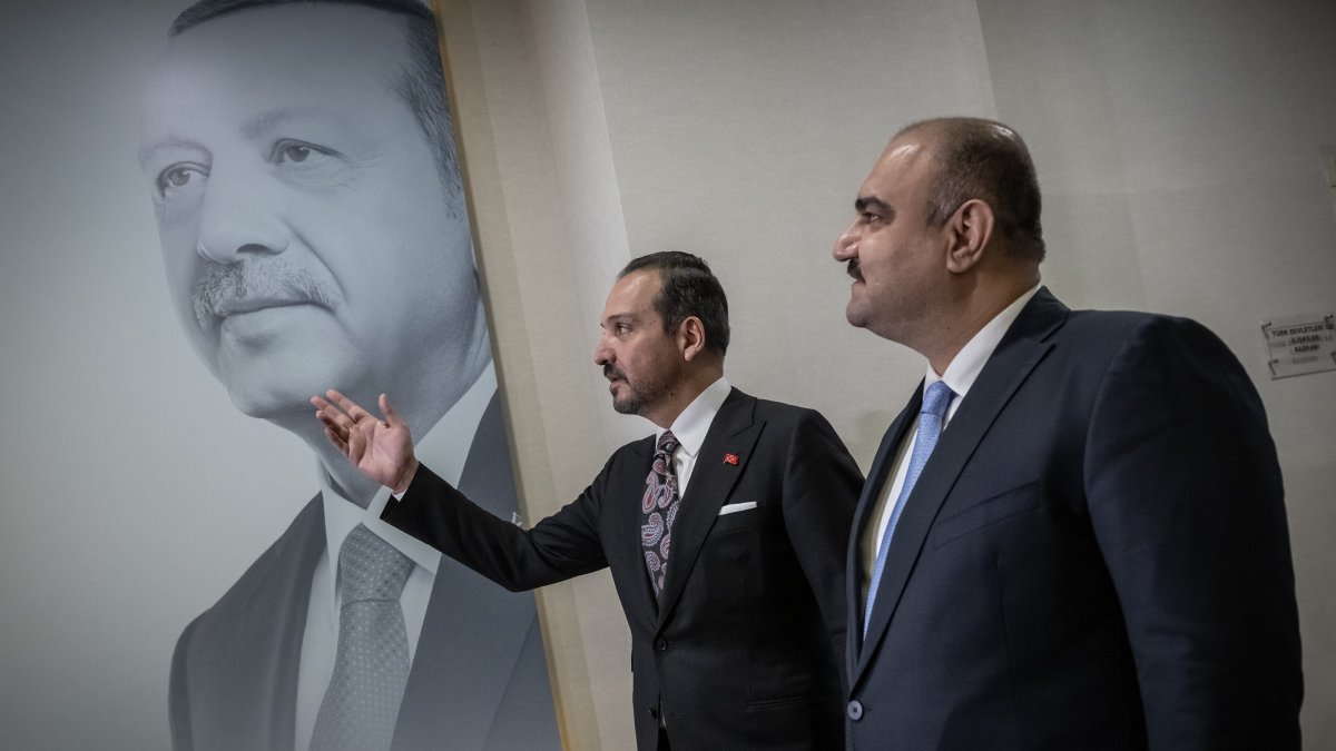 AK Party deputy chair Kürşad Zorlu (L) speaks to Kirkuk Governor Agha in front of a poster of President Erdoğan, in Ankara, Türkiye, June 1, 2026. (AA Photo) 