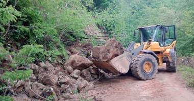 A vehicle clears debris after a landslide caused by heavy rainfall, Ordu, Türkiye, May 22, 2026. (AA Photo)