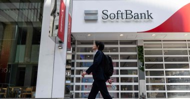 A man walks past a Softbank store in Tokyo, Japan, May 13, 2026. (AFP Photo)
