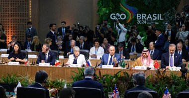 Russian Foreign Minister Sergey Lavrov (C), Saudi Foreign Minister Prince Faisal bin Farhan Al Saud,(2nd R), Foreign Minister Hakan Fidan (R) and other officials attend the first working session of the G20 Foreign Ministers' Meeting, Rio de Janeiro, Brazil, Feb. 21, 2024. (Getty Images Photo)
