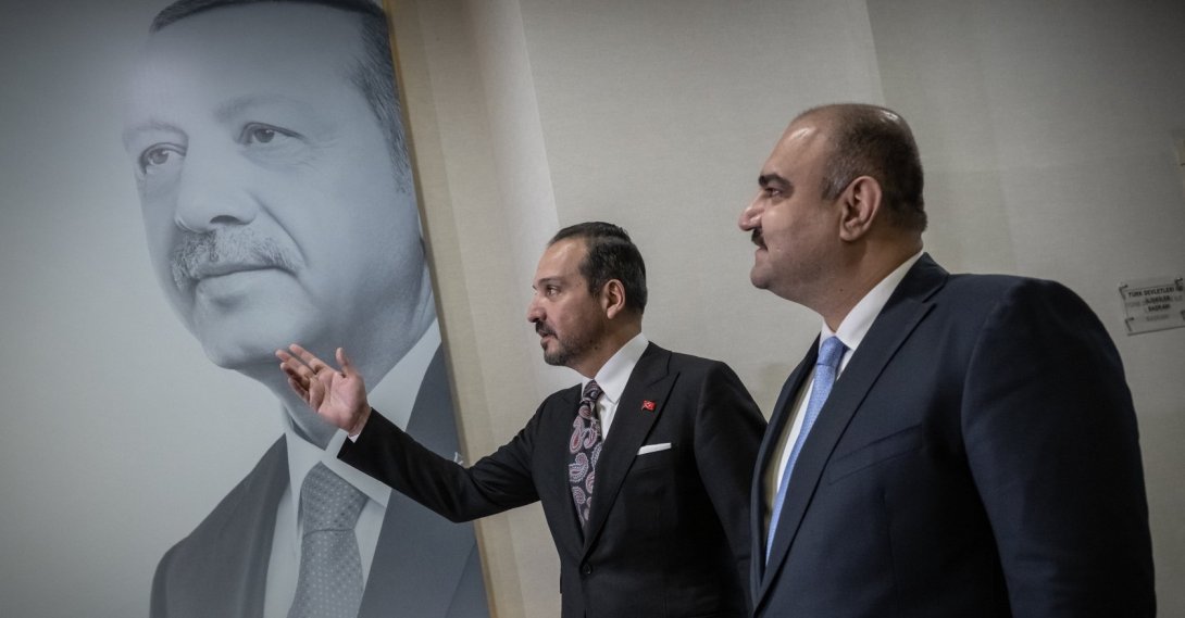 AK Party deputy chair Kürşad Zorlu (L) speaks to Kirkuk Governor Agha in front of a poster of President Erdoğan, in Ankara, Türkiye, June 1, 2026. (AA Photo) 