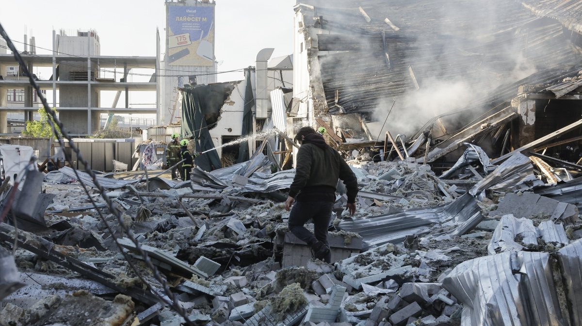 Ukrainian rescuers work at the site of a Russian strike on a car dealership in Kyiv, Ukraine, June 2, 2026. (EPA Photo)