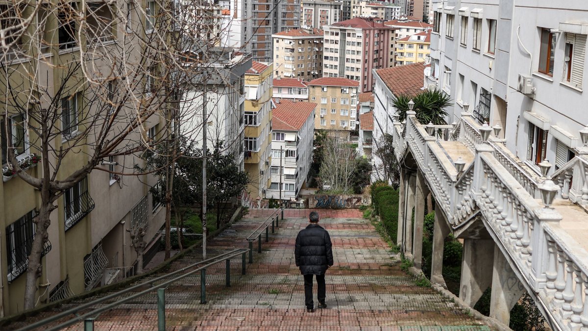 A man walks amid apartment buildings of the Maltepe district, Istanbul, Türkiye, April 3, 2023. (EPA Photo)