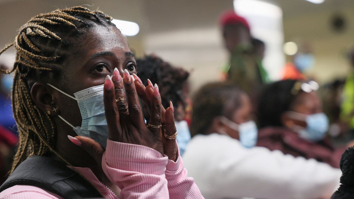 A woman reacts as Ghanaian nationals are evacuated from South Africa following xenophobia attacks wait at Accra International Airport in Accra, Ghana, May 27, 2026. (AFP Photo)