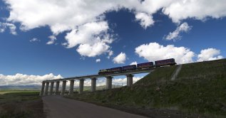 A train runs along a section of the newly opened Baku-Tbilisi-Kars (BTK) railway line, near Akhalkalaki, Georgia June 2, 2026. (Reuters Photo)