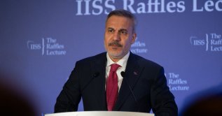 Foreign Minister Hakan Fidan delivers remarks at an event organized by the International Institute for Strategic Studies (IISS) during his visit to Singapore, June 2, 2026. (AA Photo)