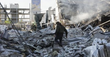 Ukrainian rescuers work at the site of a Russian strike on a car dealership in Kyiv, Ukraine, June 2, 2026. (EPA Photo)