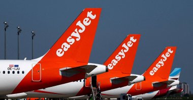 Passengers board an easyJet aircraft at the Berlin Brandenburg Airport in Schoenefeld, Germany, April 21, 2026. (Reuters Photo)