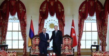 President Recep Tayyip Erdoğan and Armenia's Prime Minister Nikol Pashinyan shake hands during their meeting at the Dolmabahçe Presidential office in Istanbul. (Photo by Handout / Turkish Presidency Press Office / AFP, File)