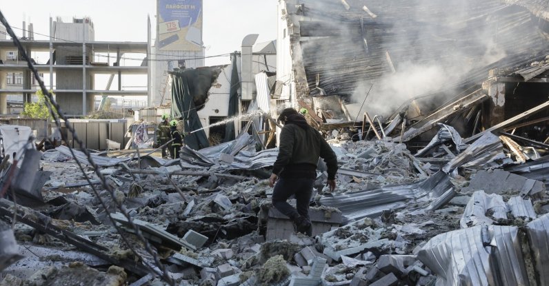 Ukrainian rescuers work at the site of a Russian strike on a car dealership in Kyiv, Ukraine, June 2, 2026. (EPA Photo)