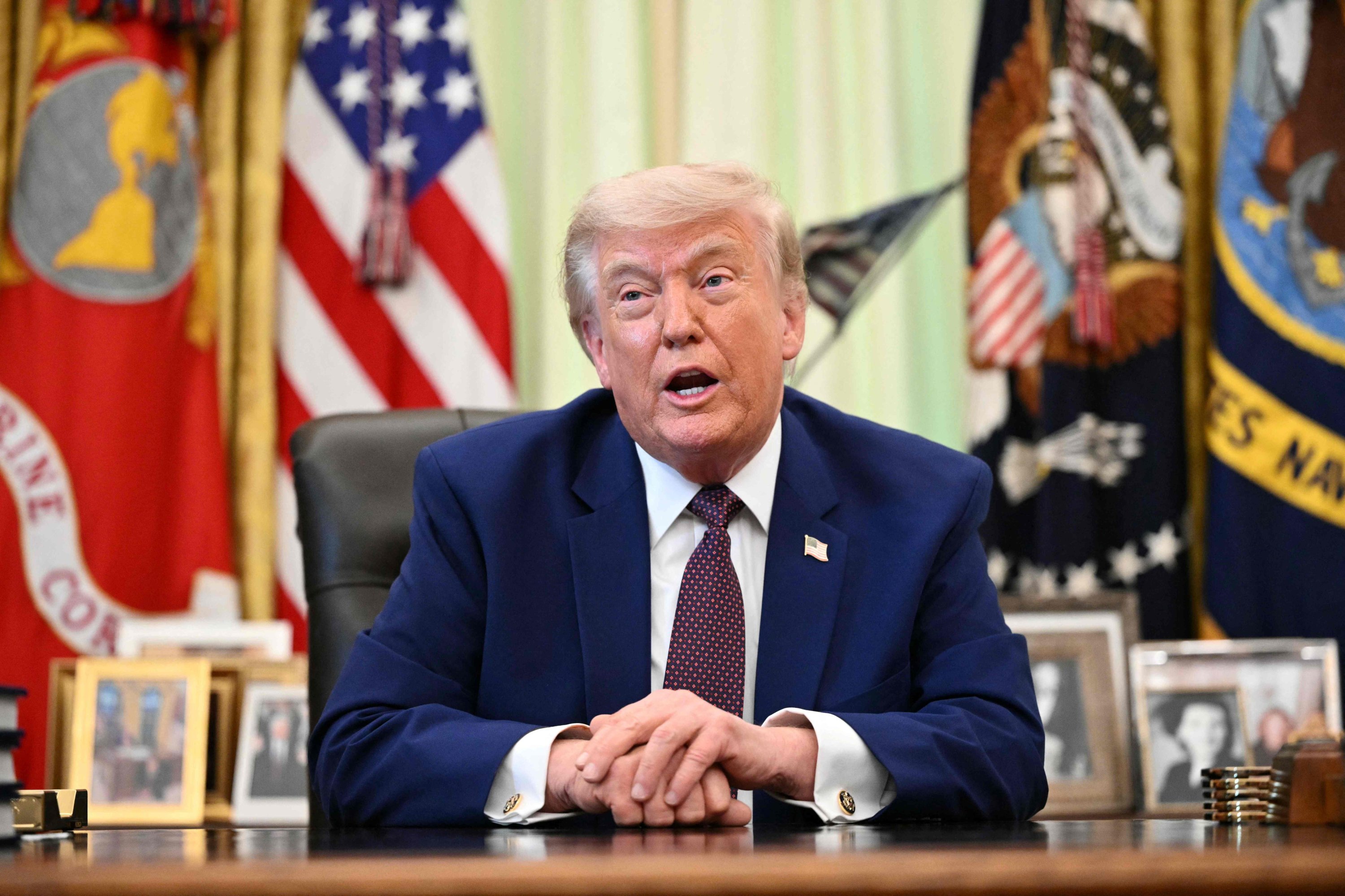 Trump says Iran talks gaining momentum, hints at weekend breakthrough