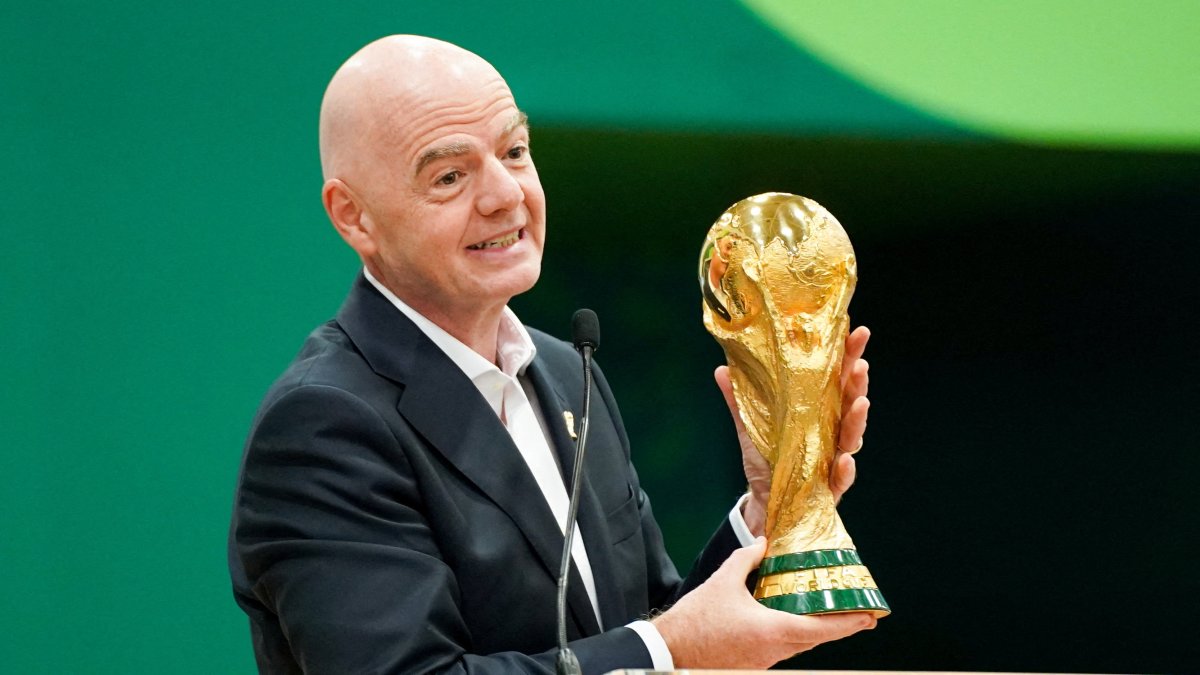FIFA President Gianni Infantino holds the World Cup trophy while he speaks during the grand opening of the 2026 FIFA World Cup international broadcast center at Kay Bailey Hutchison Convention Center, Dallas, U.S., June 1, 2026. (Reuters Photo)
