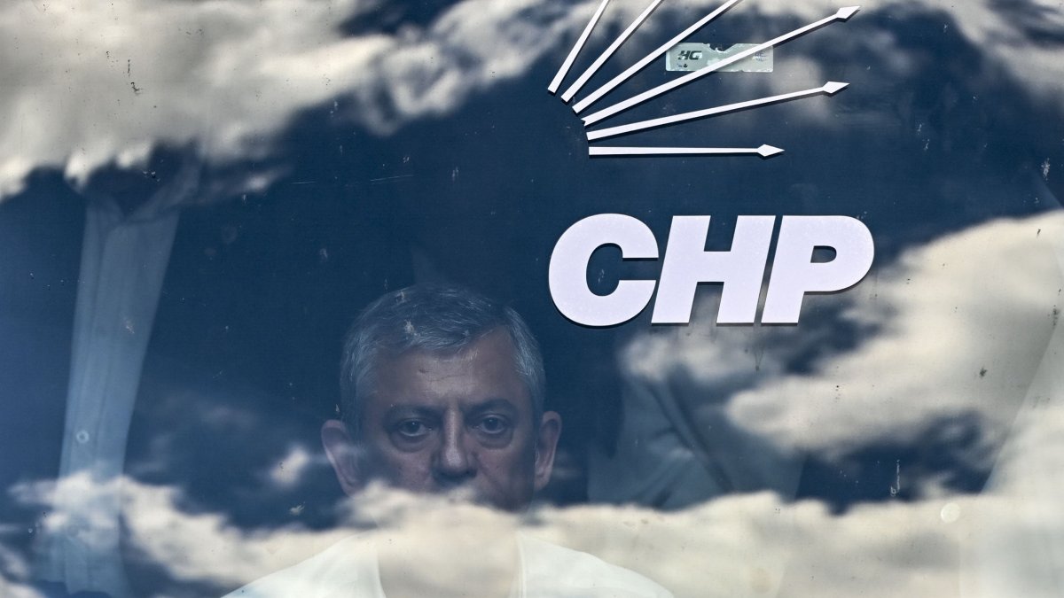 Özgür Özel, now merely a lawmaker for the CHP, looks through the window of a bus with the logo of his party, Ankara, Türkiye, May 30, 2026. (AA Photo)