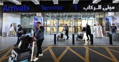 Passengers arrive at Kuwait International Airport in Kuwait City on June 1, 2026. (AFP Photo)