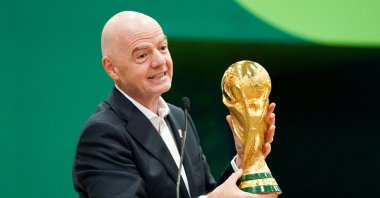 FIFA President Gianni Infantino holds the World Cup trophy while he speaks during the grand opening of the 2026 FIFA World Cup international broadcast center at Kay Bailey Hutchison Convention Center, Dallas, U.S., June 1, 2026. (Reuters Photo)