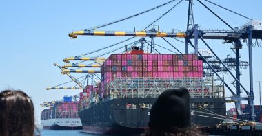 People taking a boat tour watch freight ships full of containers at the Port of Los Angeles, California, U.S., May 9, 2026. (AFP Photo)
