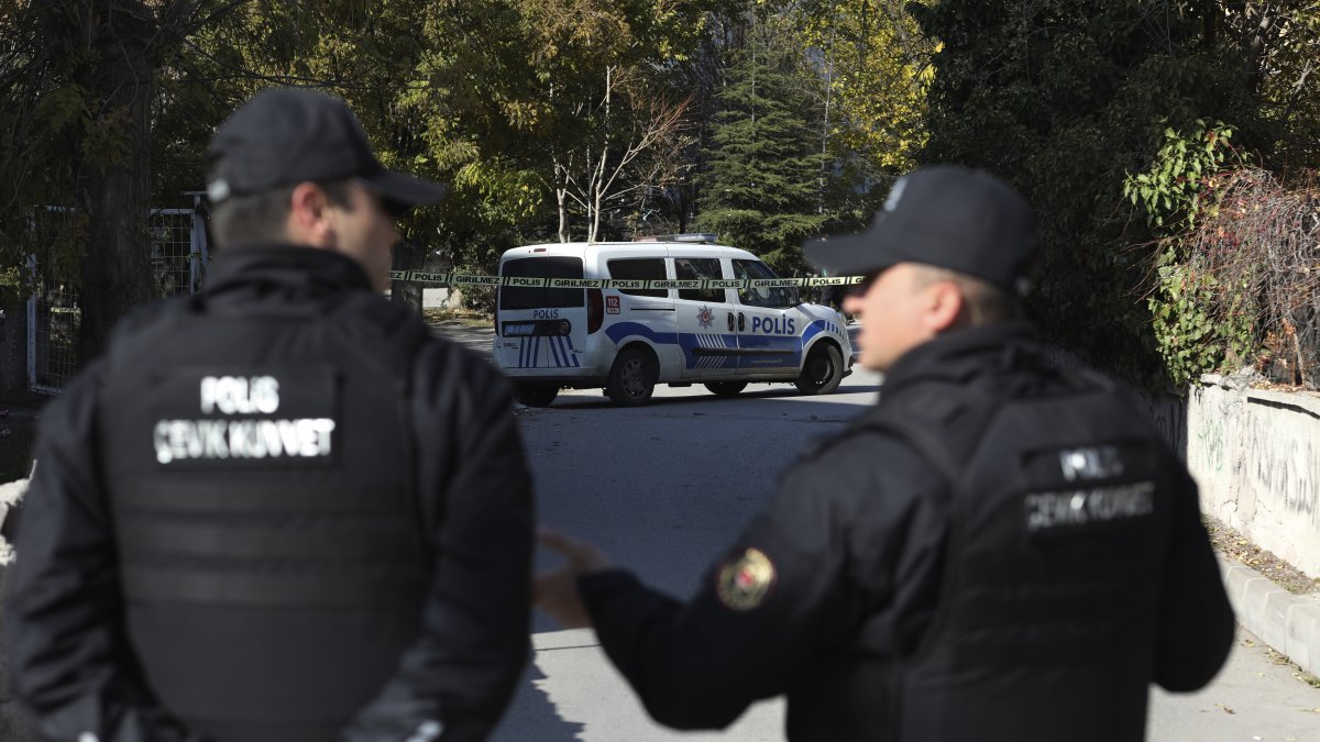 Police officers stand at the entrance of a neighborhood, Ankara, Türkiye, Nov. 11, 2022. (AP Photo)