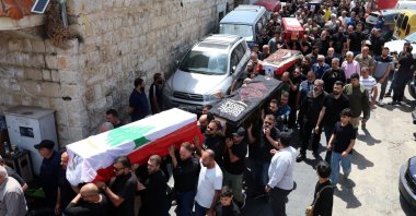 Mourners carry the coffins of members of a displaced Lebanese family, parents Hassan Abdullah and Hanan Shehab, along with their children Leen, Ali, Ibrahim and Julia, who were killed in an Israeli airstrike, during their funeral procession, Wardaniyeh, Lebanon, June 3, 2026. (EPA Photo)
