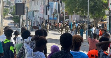 Members of Somali government forces stand among civilians at a street junction ahead of a planned protest, in Mogadishu, Somalia, June 4, 2026. (Reuters Photo)