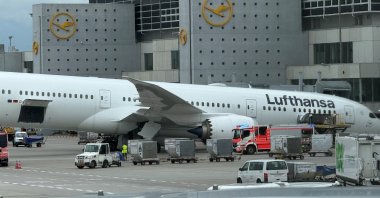 A Lufthansa Boeing 787-9 Dreamliner aircraft lies on its nose in front of a terminal at Frankfurt Airport after the nose landing gear collapsed, Frankfurt, Germany, June 4, 2026. (AP Photo)
