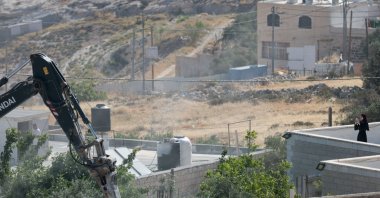 An Israeli military excavator demolishes a Palestinian building in the town of Jabaa in the Israeli-occupied West Bank, near Jerusalem June 3, 2026. (Reuters Photo)